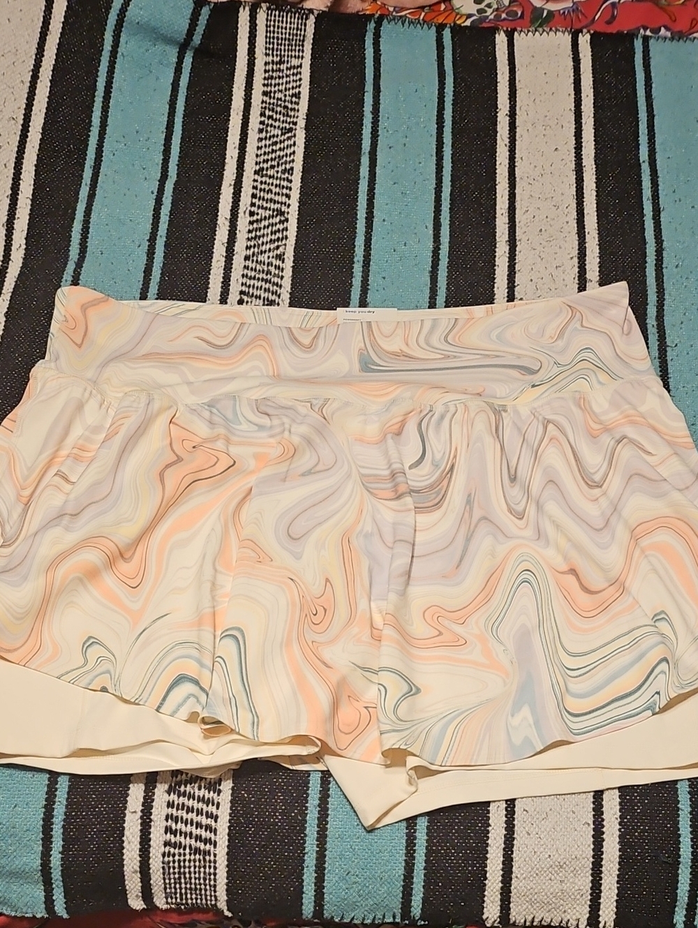 Old Navy Cream Marble-Print Skirted Shorts with Pastel Peach and Blue Swirls